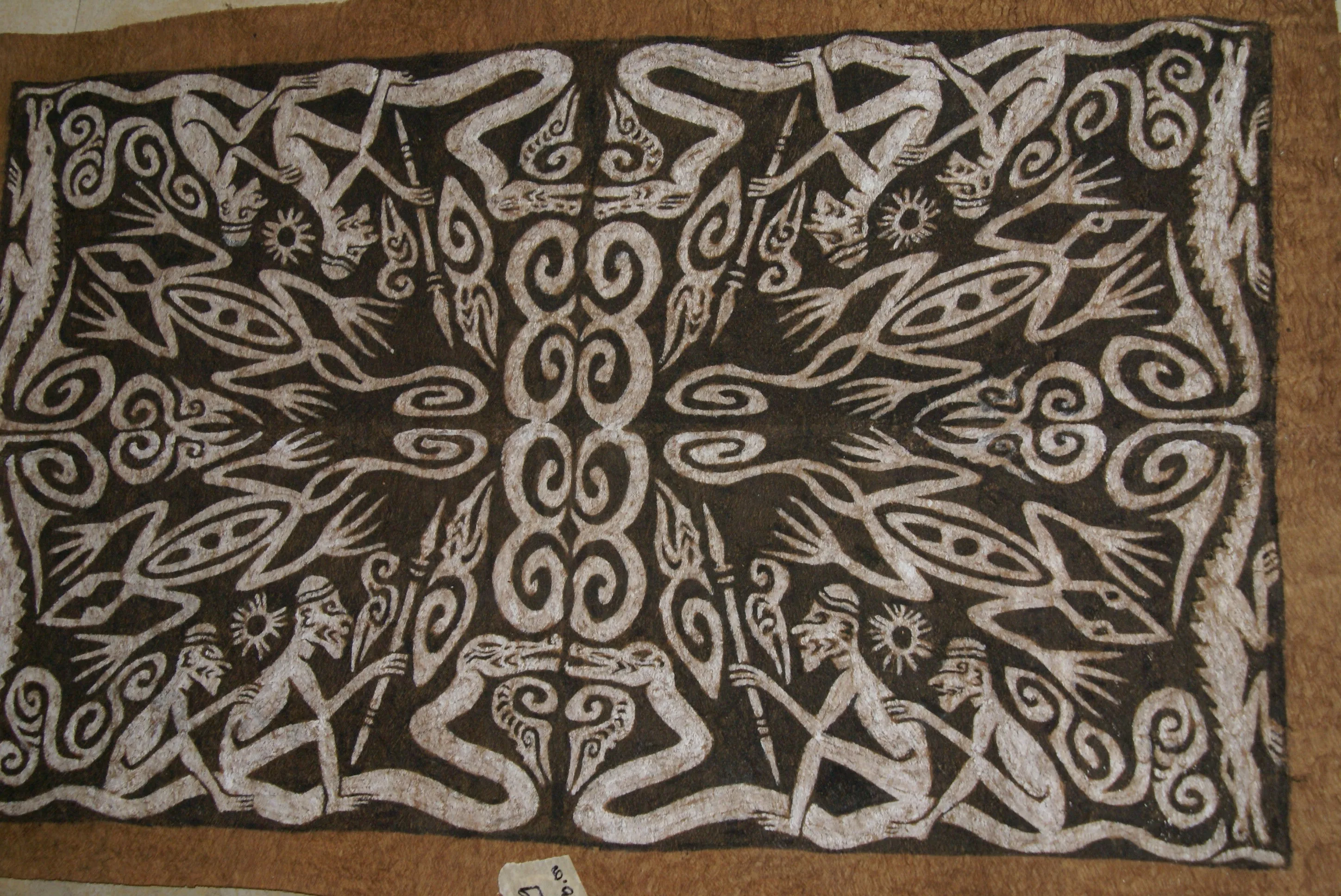 Rare Tapa Bark Cloth (Kapa in Hawaii), from Lake Sentani, Irian Jaya, Papua New Guinea. Hand painted by a Tribal Artist with natural pigments: Spiritual Stylized Warrior Weapons, Snakes, Crocodiles, Gecko Motifs & waves 30 1/2" x 20" (no 9)