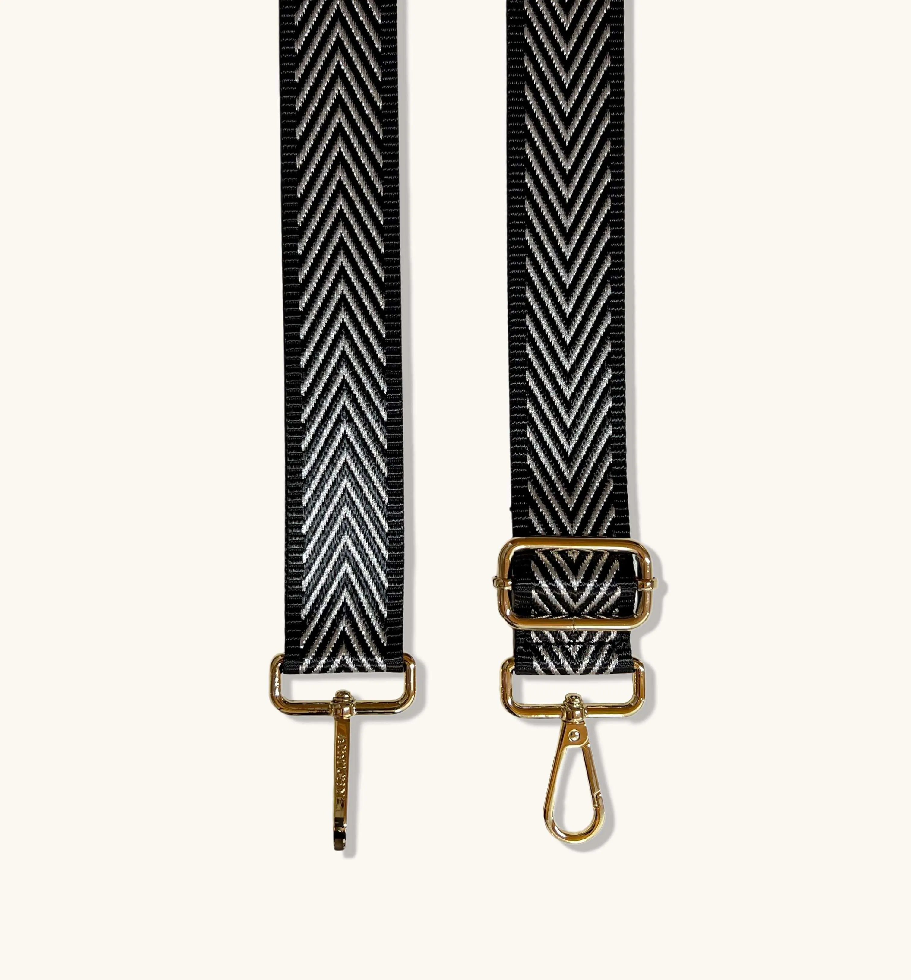 The Tassel Silver Leather Crossbody Bag With Black & Silver Chevron Strap